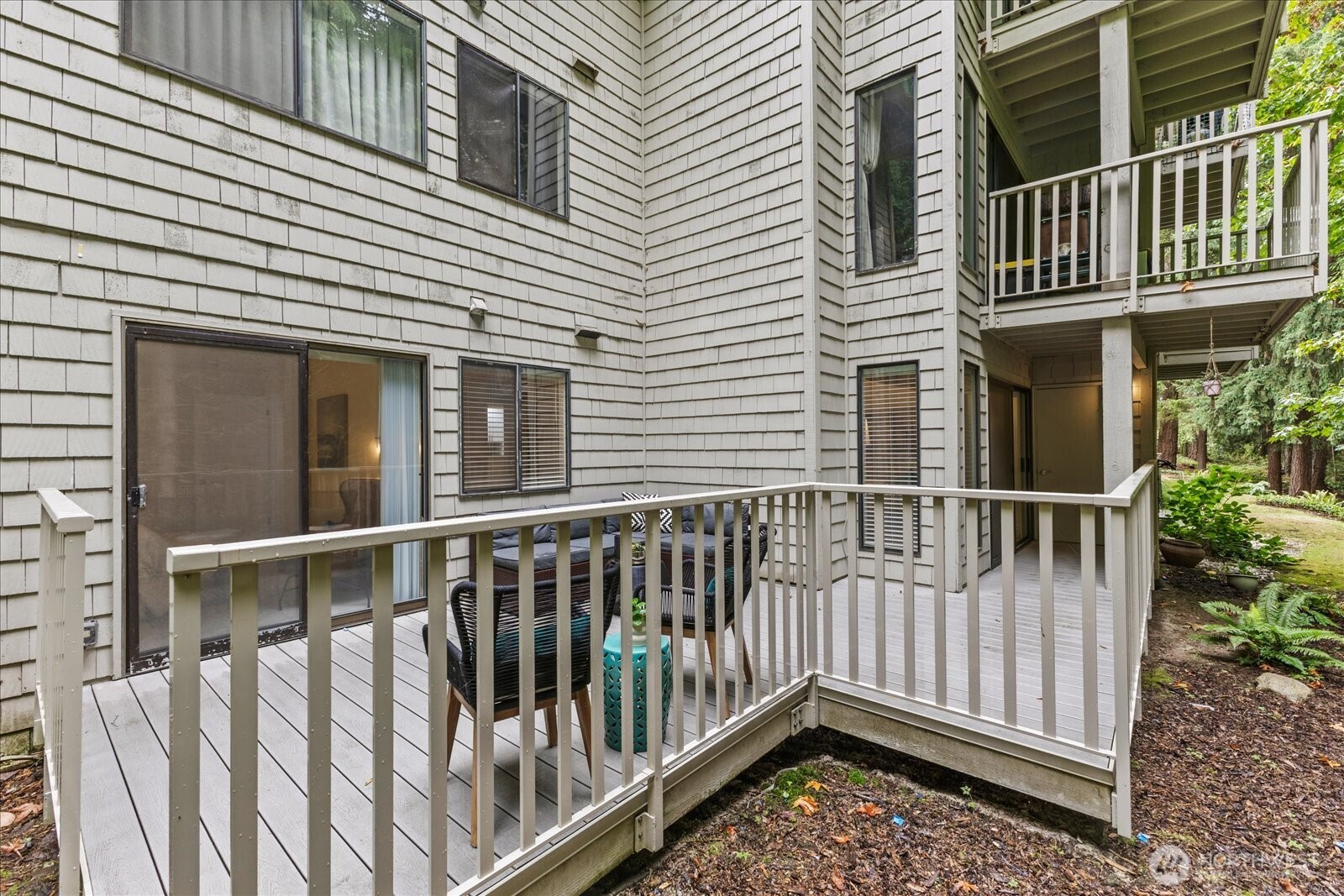 3921 108th Avenue Northeast, Unit A101 Bellevue, WA 98004 - Photo 23 of 27 a view of a wooden house with large windows