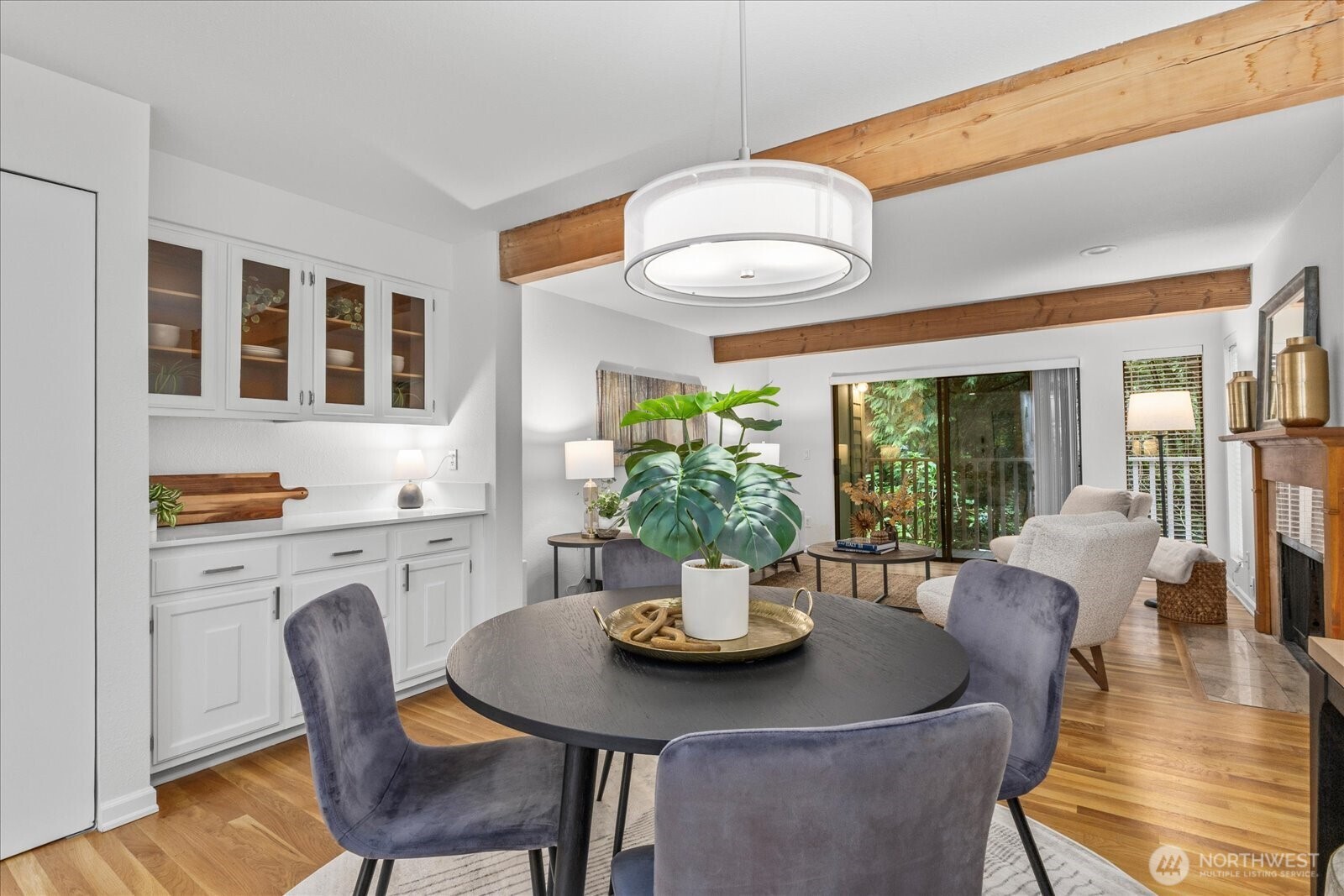 3921 108th Avenue Northeast, Unit A101 Bellevue, WA 98004 - Photo 8 of 27 a view of a dining room with furniture window and wooden floor