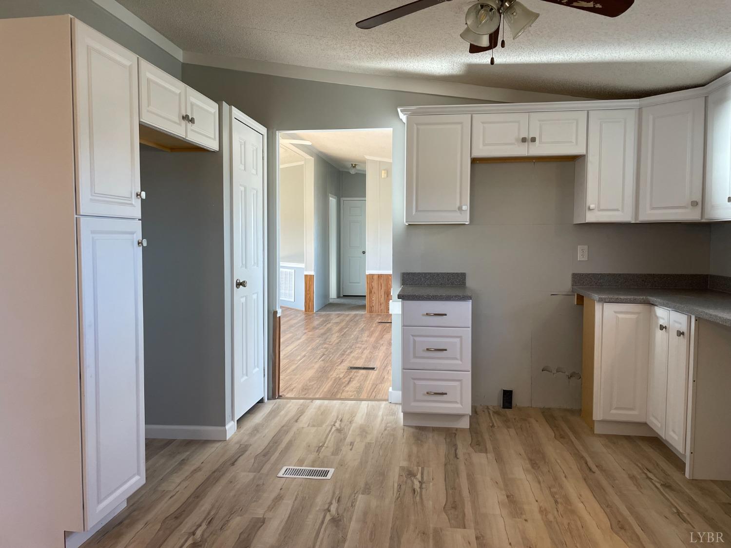 232 Camp Branch Road Gretna, VA 24557 - Photo 12 of 47 a view of room with wooden floor