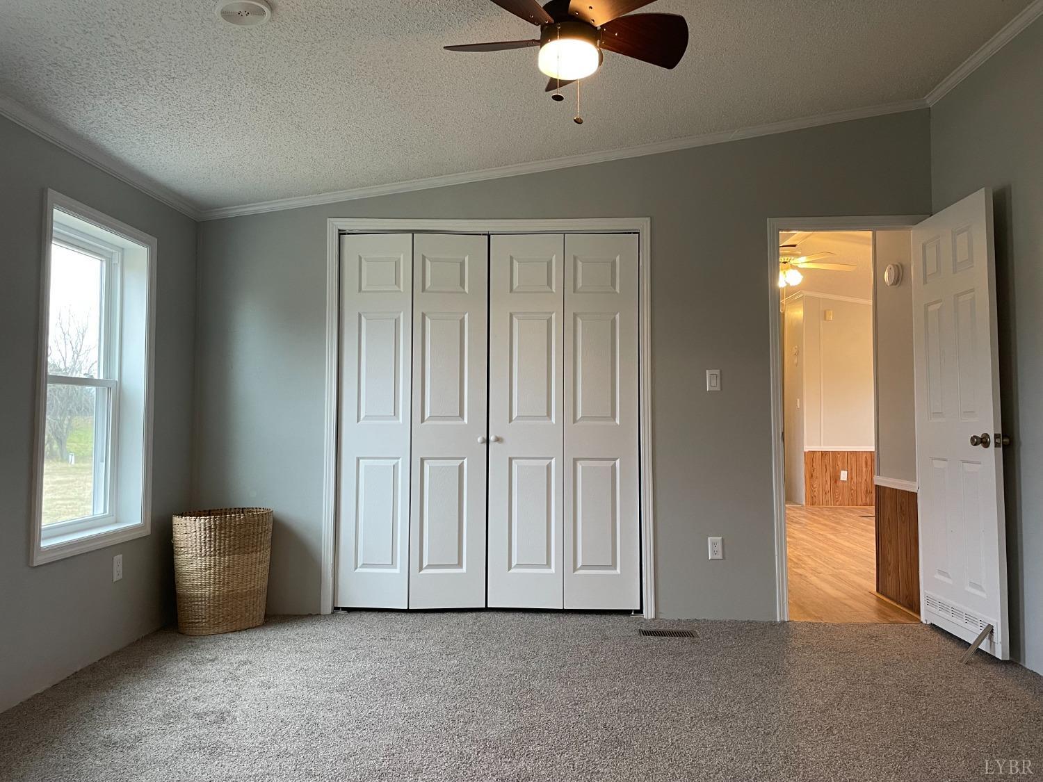 232 Camp Branch Road Gretna, VA 24557 - Photo 21 of 47 an empty room with windows and closet