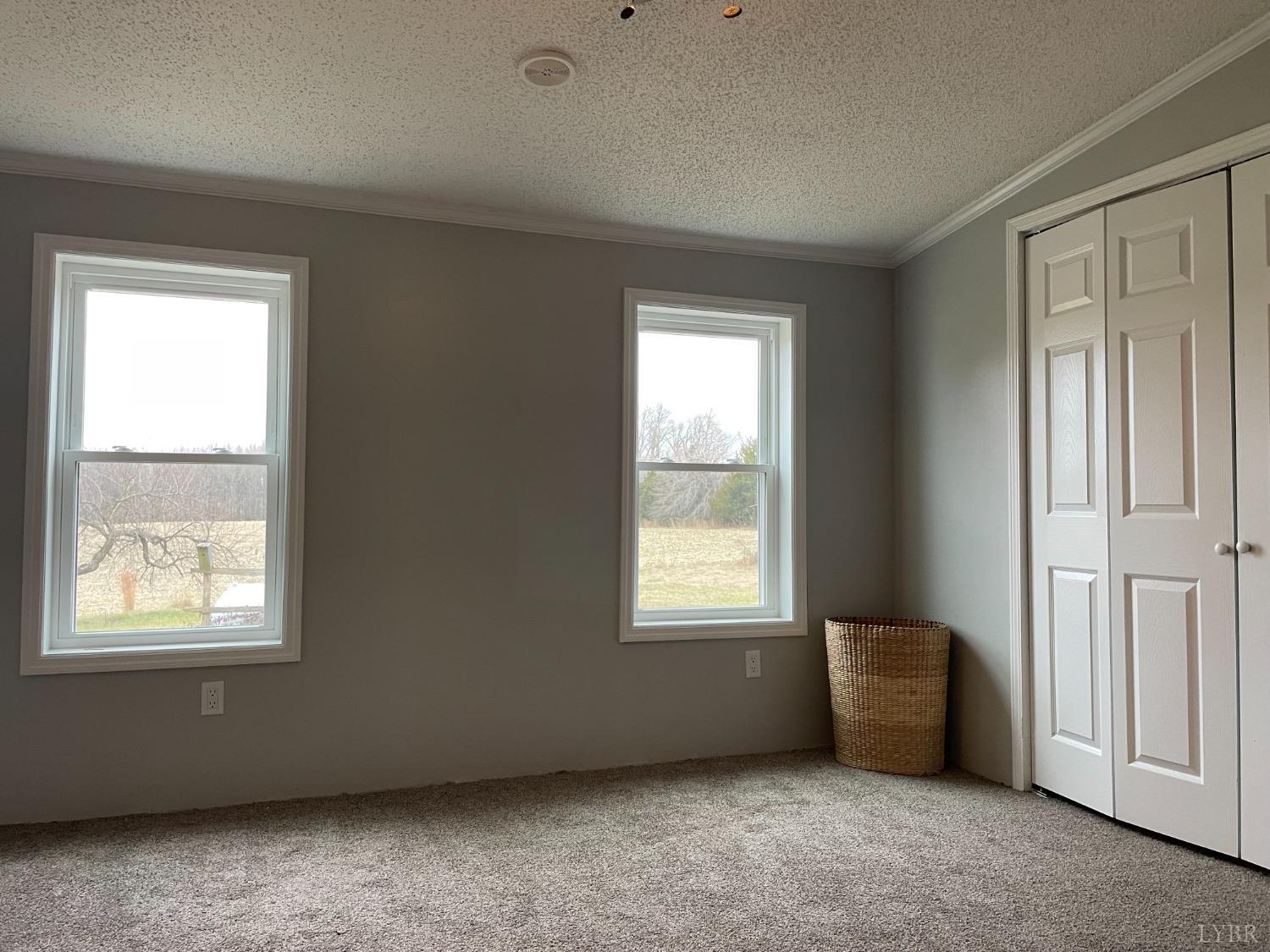 232 Camp Branch Road Gretna, VA 24557 - Photo 22 of 47 an empty room with windows
