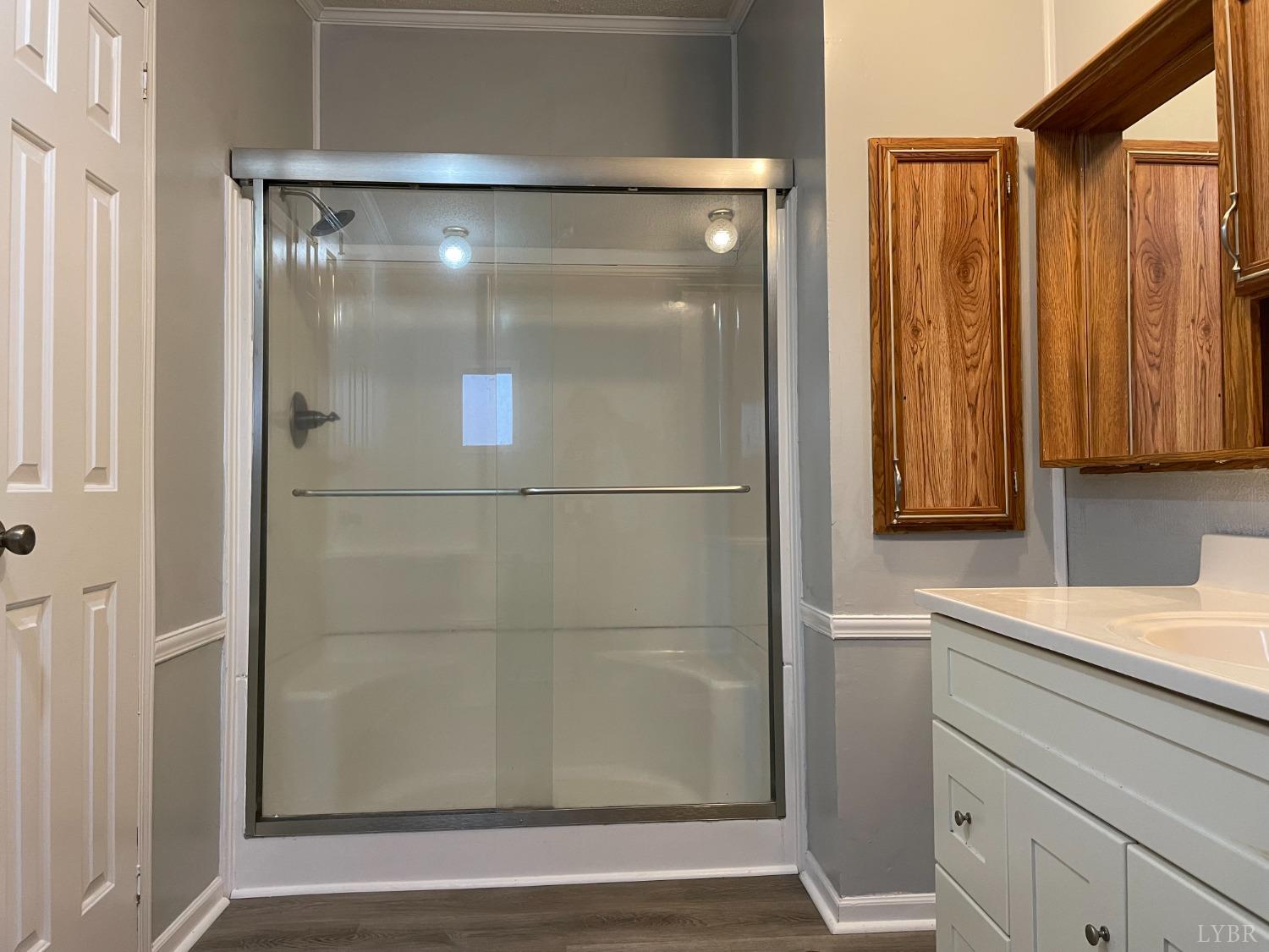 232 Camp Branch Road Gretna, VA 24557 - Photo 25 of 47 a bathroom with a shower and a sink