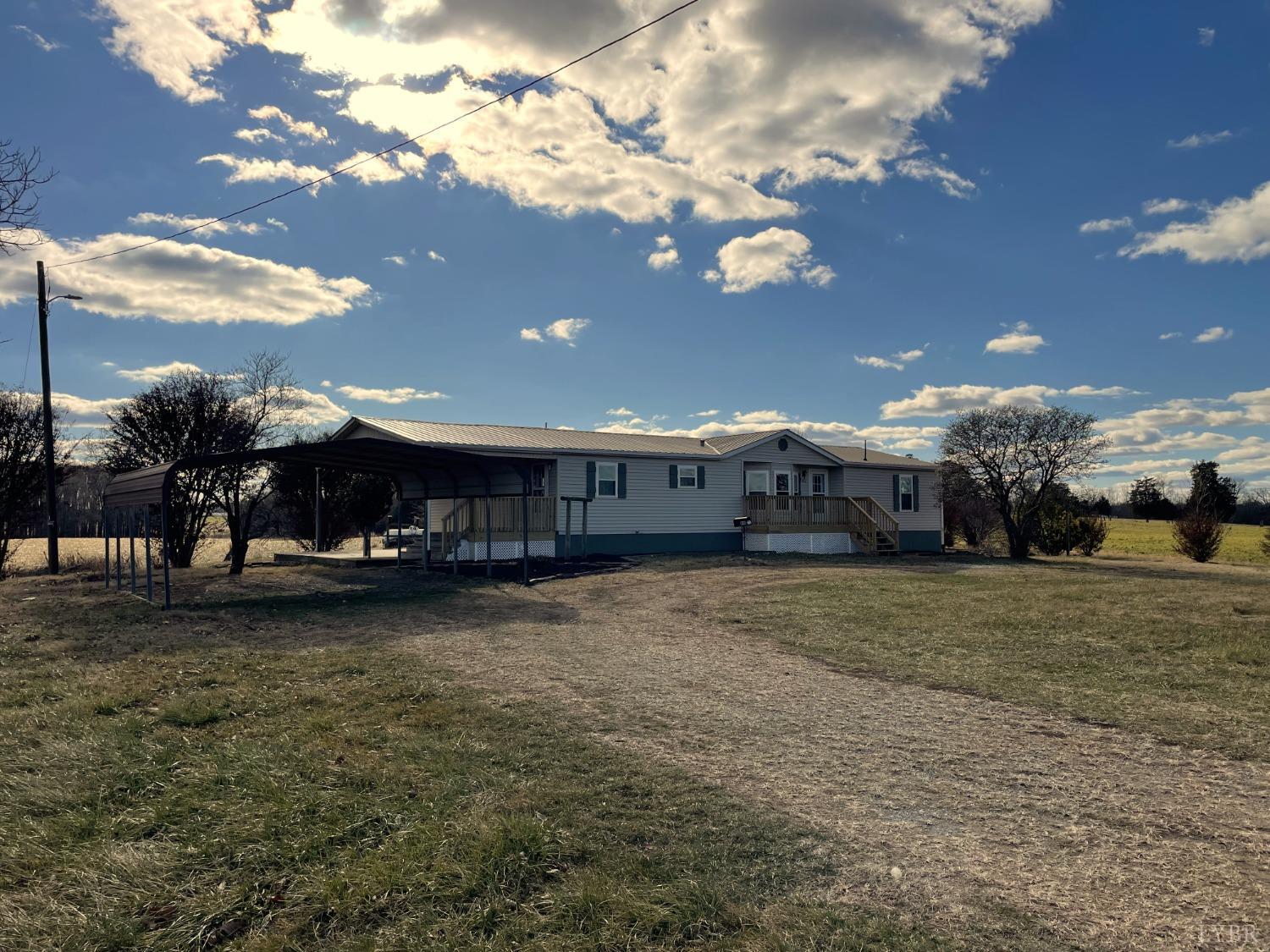232 Camp Branch Road Gretna, VA 24557 - Photo 3 of 47 a view of a house with a yard