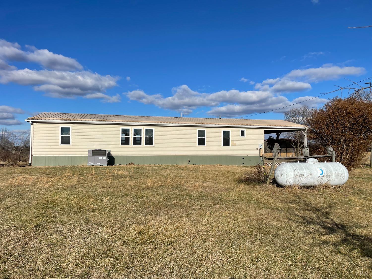 232 Camp Branch Road Gretna, VA 24557 - Photo 43 of 47 a backyard of a house with table and chairs