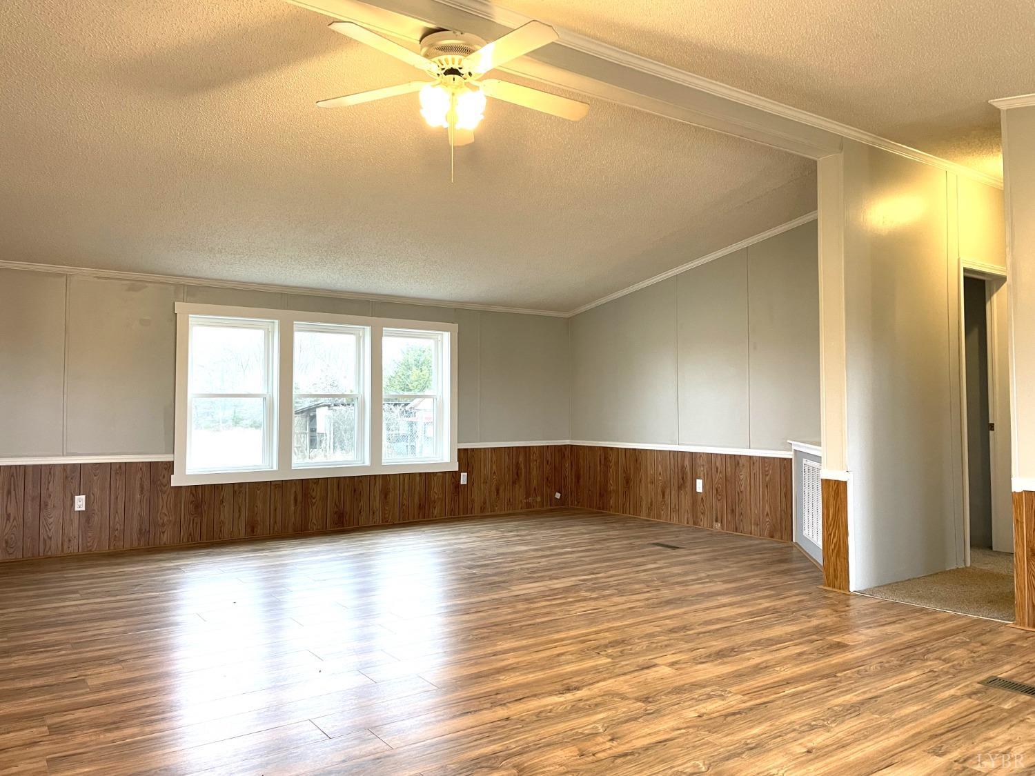 232 Camp Branch Road Gretna, VA 24557 - Photo 8 of 47 a view of room with window and wooden floor