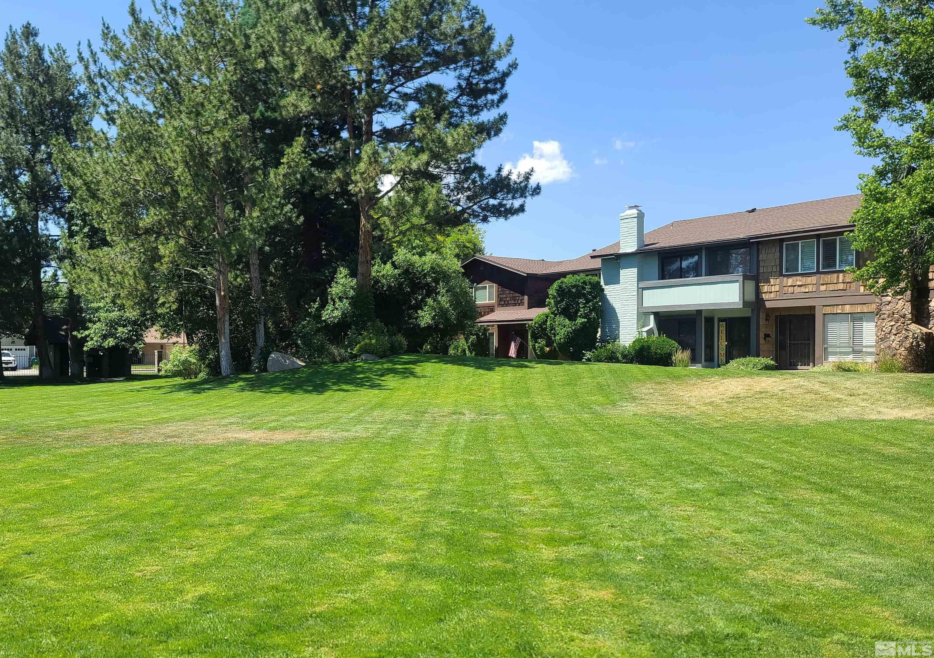 a view of a house with a yard