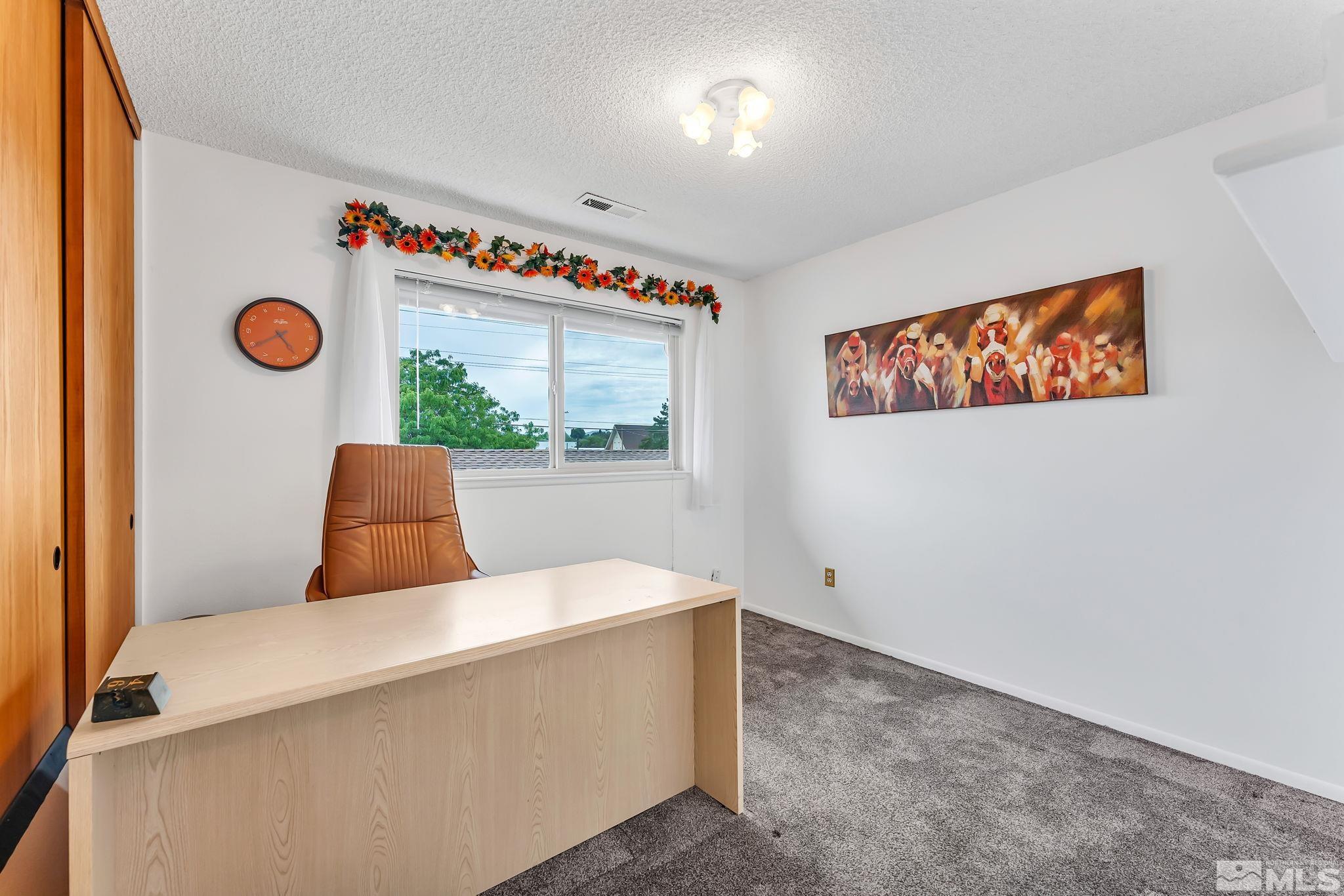 1407 Foster Drive Reno, NV 89509 - Photo 26 of 34 a bedroom with bed and a window