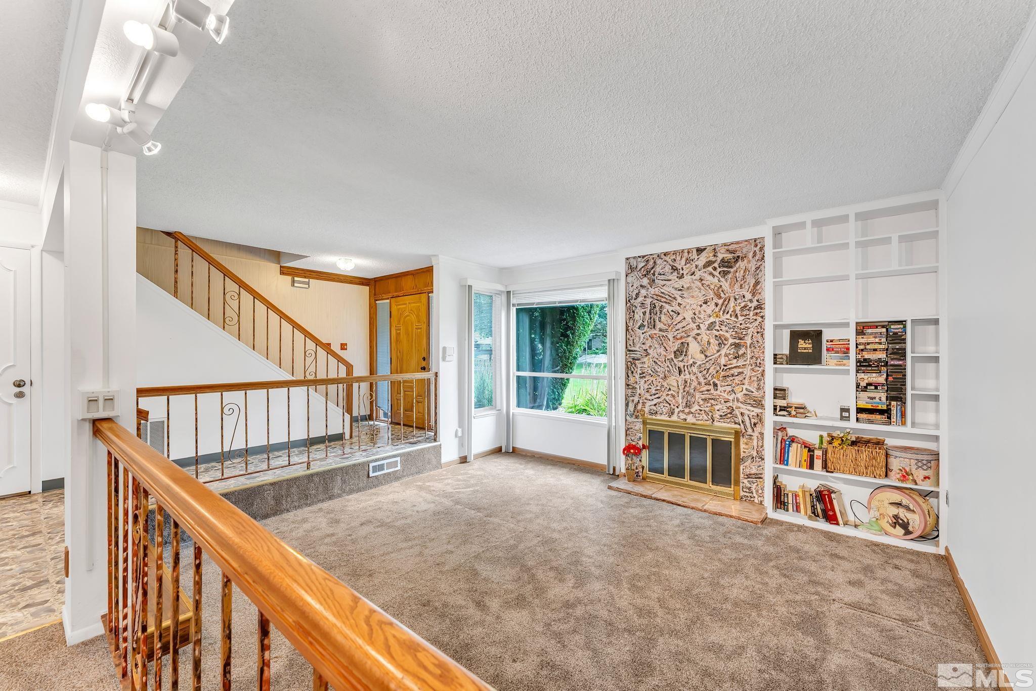1407 Foster Drive Reno, NV 89509 - Photo 6 of 34 a view of livingroom with furniture and stairs