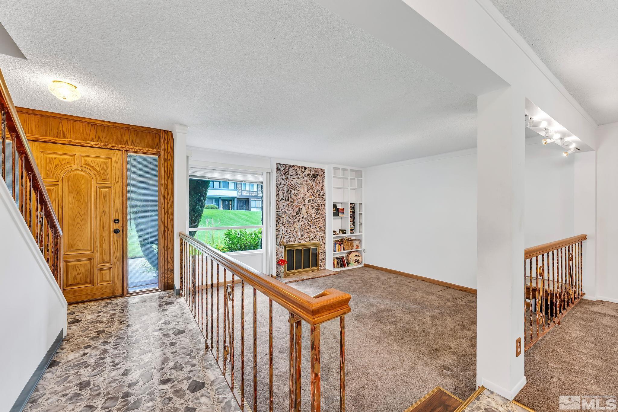 1407 Foster Drive Reno, NV 89509 - Photo 7 of 34 a view of a hallway with windows