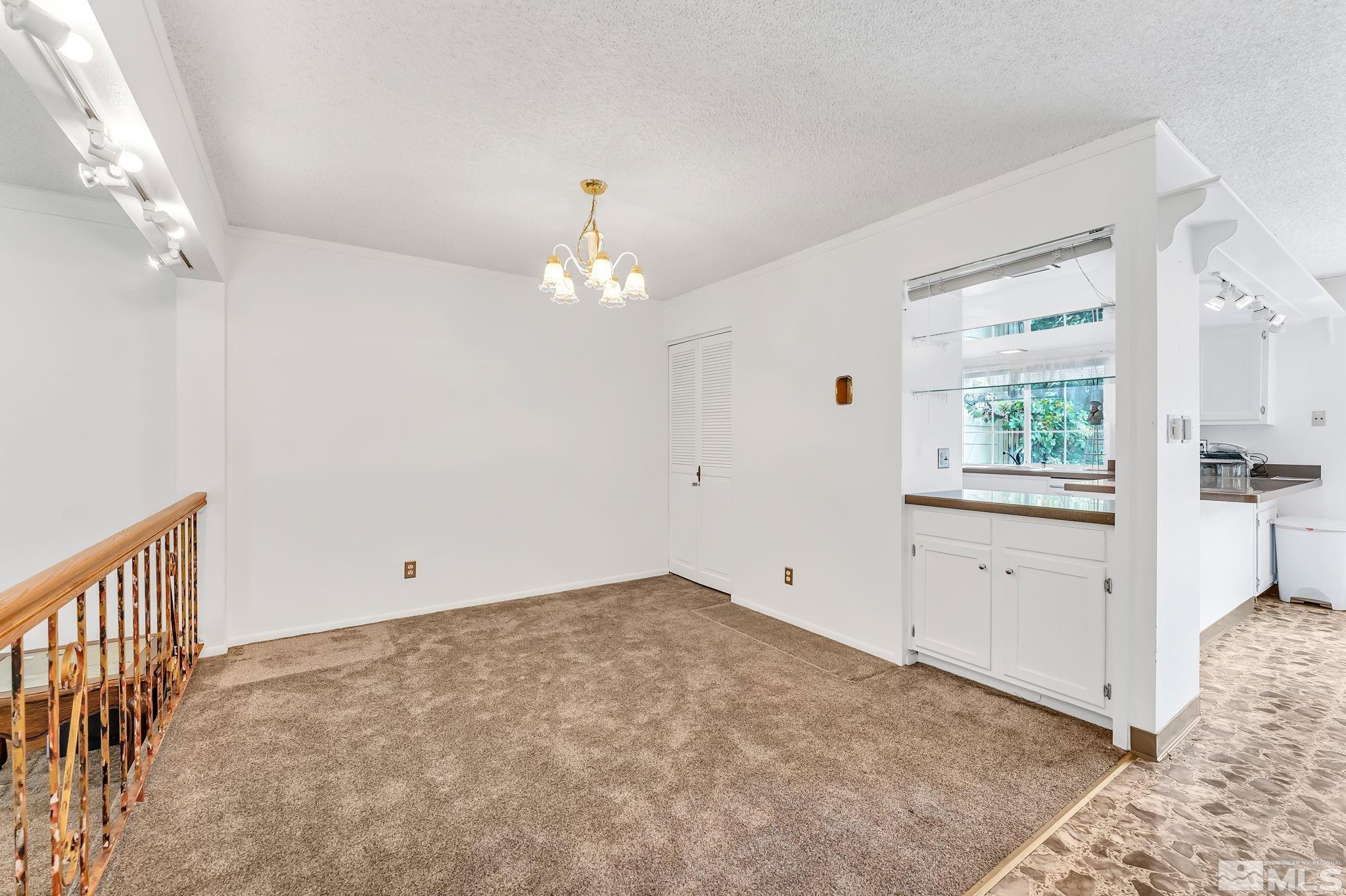 1407 Foster Drive Reno, NV 89509 - Photo 8 of 34 wooden floor in an empty room with a window