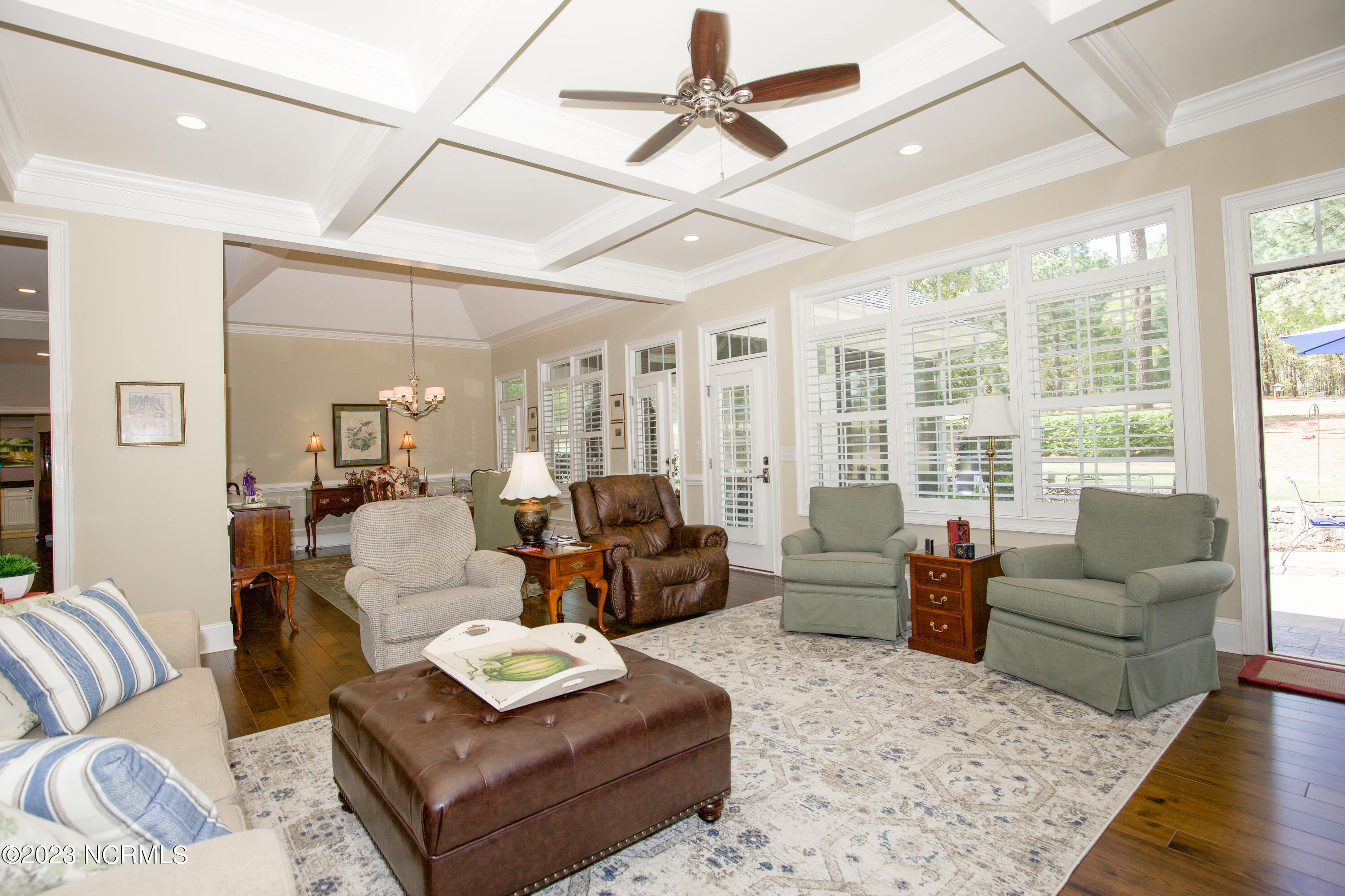 153 National Drive Pinehurst, NC 28374 - Photo 12 of 60 Living Room with exit to patio area.