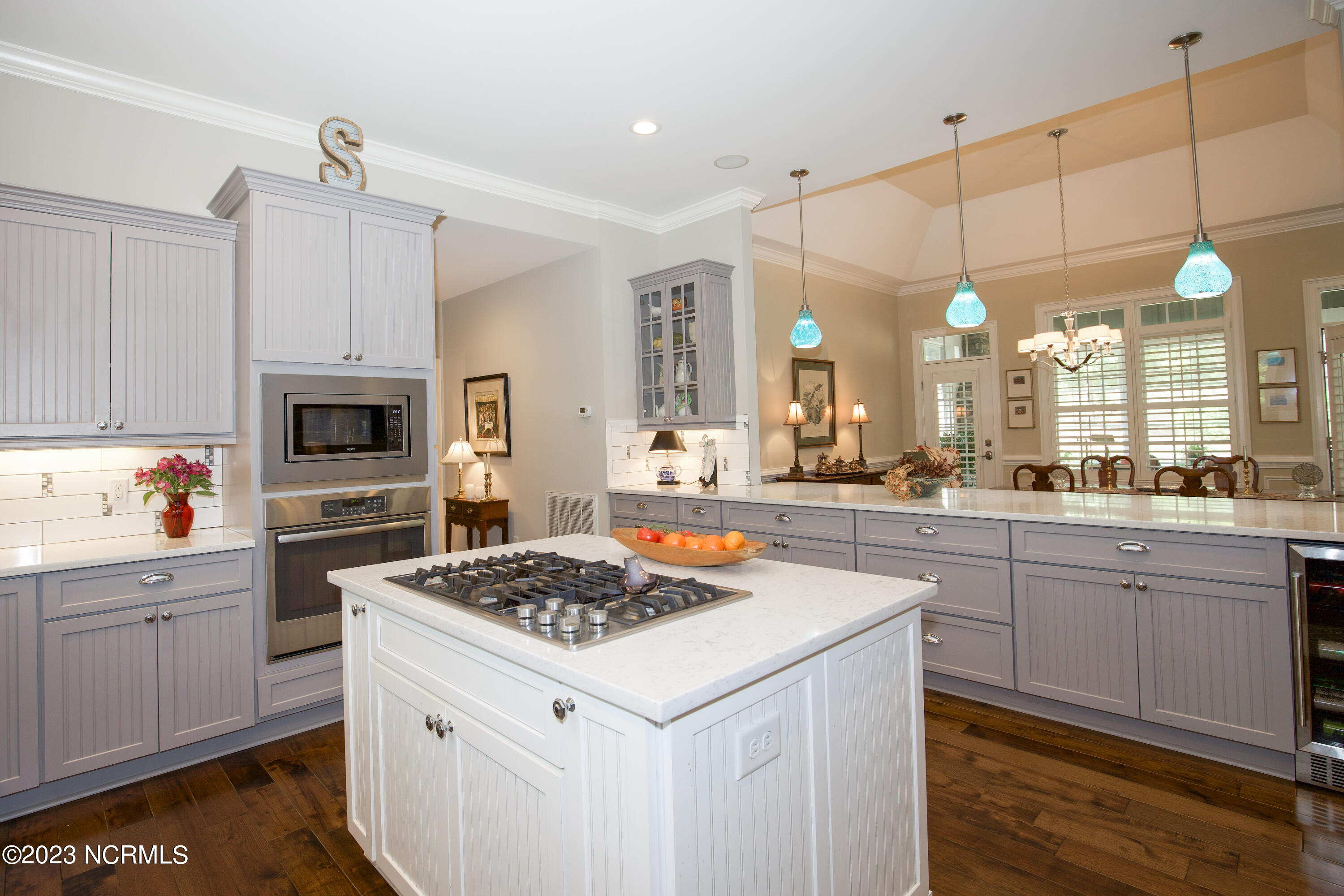 153 National Drive Pinehurst, NC 28374 - Photo 14 of 60 Kitchen Island with gas cook top.