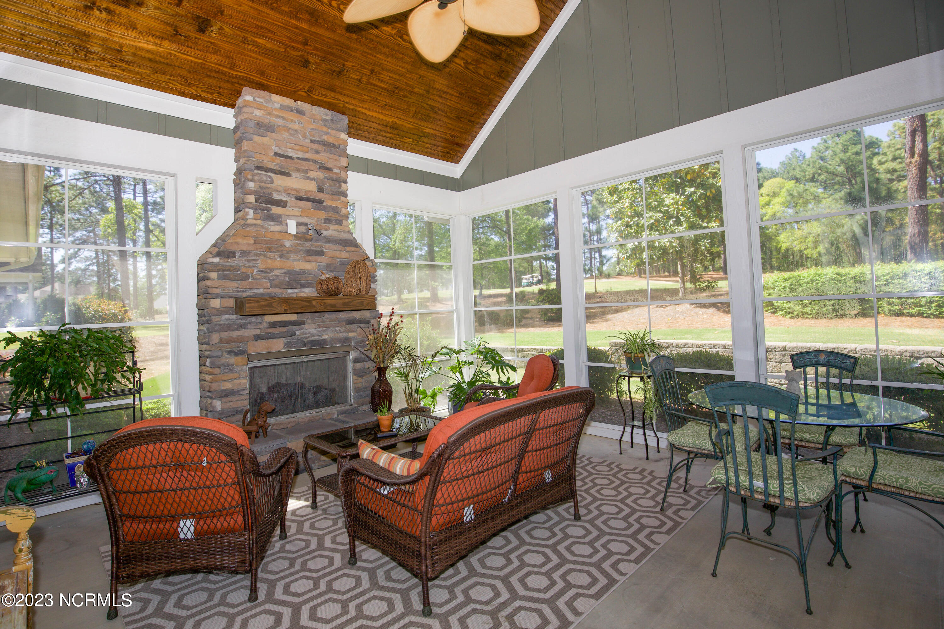 153 National Drive Pinehurst, NC 28374 - Photo 26 of 60 Gas log fireplace in sunroom
