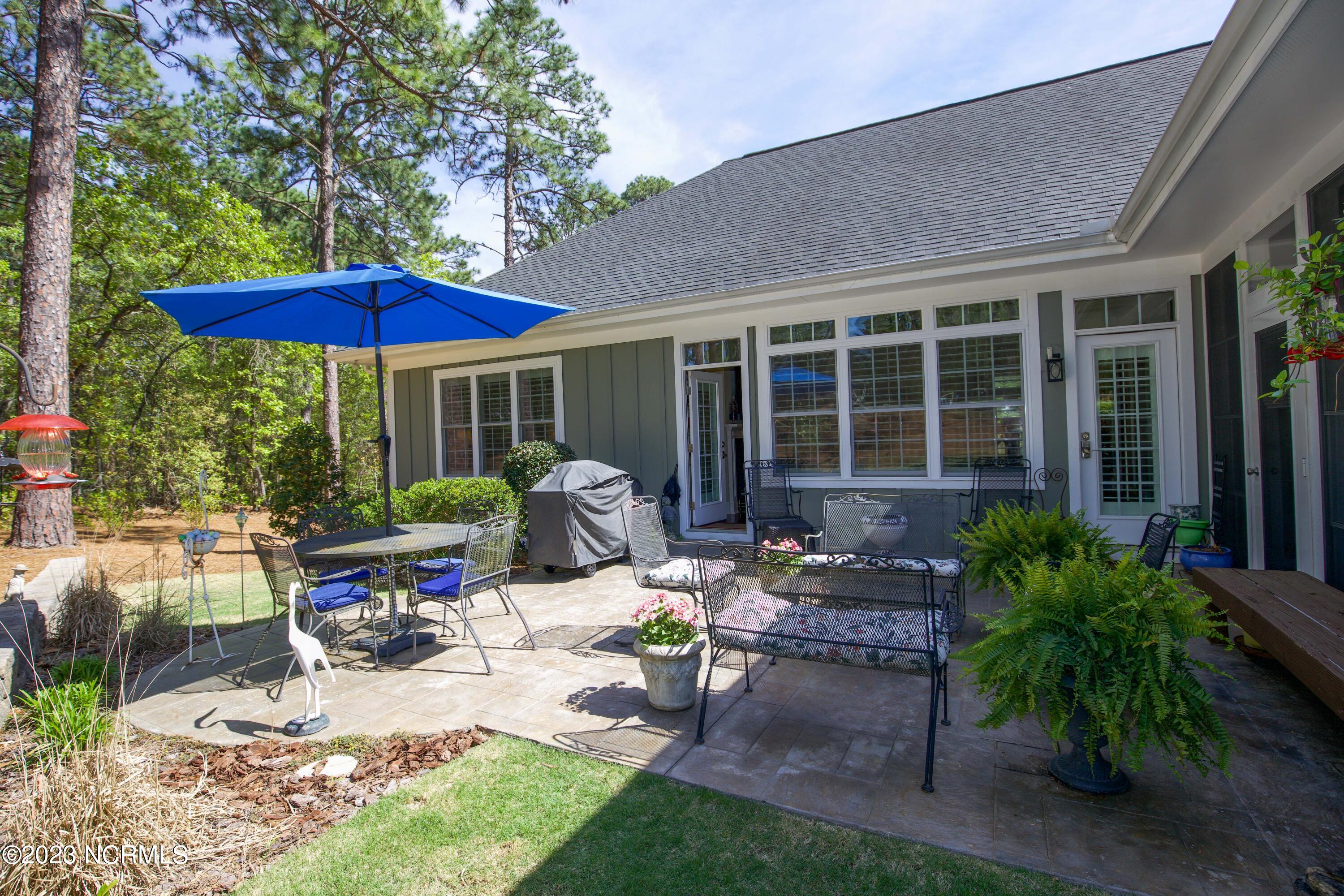 153 National Drive Pinehurst, NC 28374 - Photo 52 of 60 Patio just off sun room and living rm