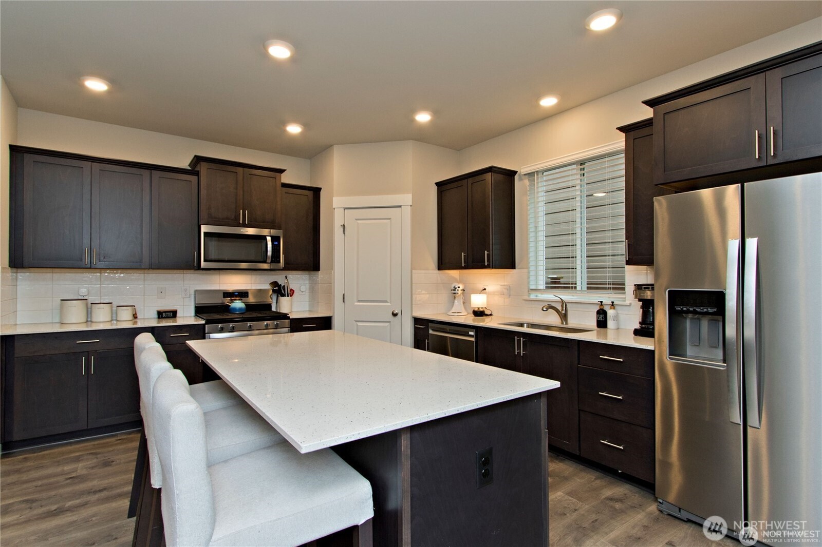 28252 33rd Place South Auburn, WA 98001 - Photo 13 of 33 a kitchen with a refrigerator a sink a stove a microwave and cabinets