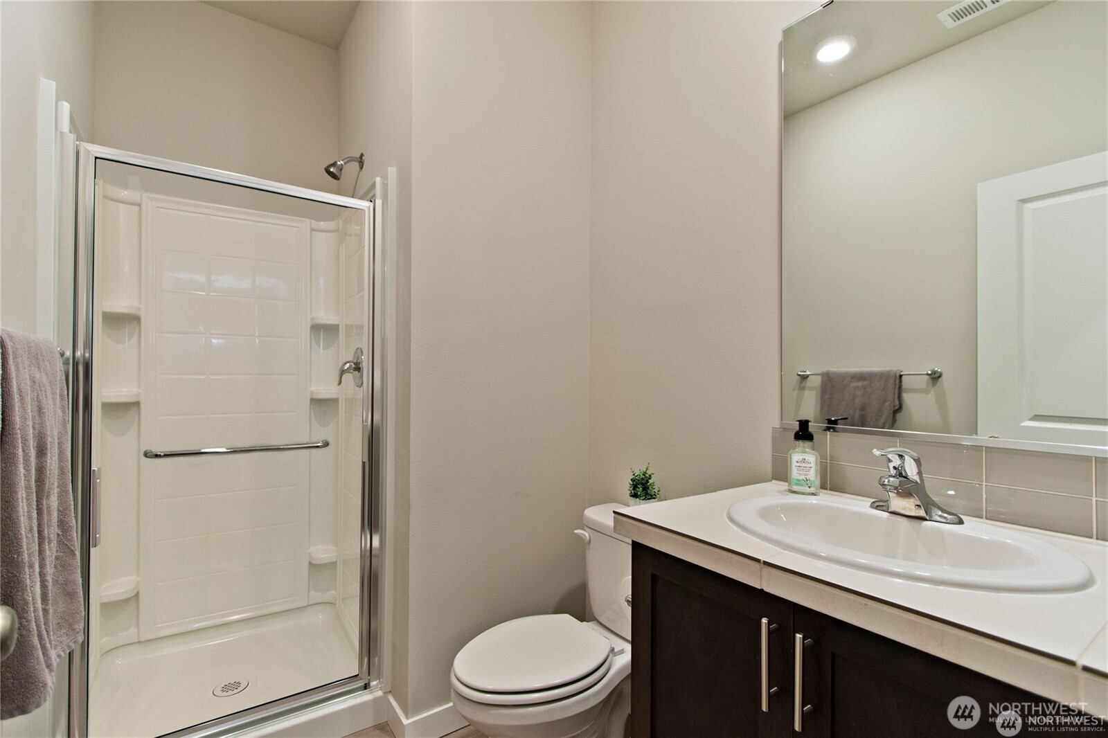 28252 33rd Place South Auburn, WA 98001 - Photo 16 of 33 a bathroom with a sink a toilet and shower