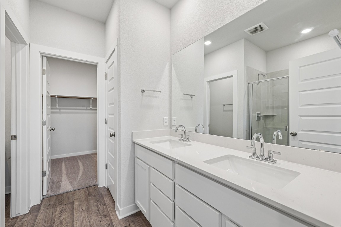 1216 Lavender Way Georgetown, TX 78628 - Photo 16 of 40 a bathroom with a sink and a mirror