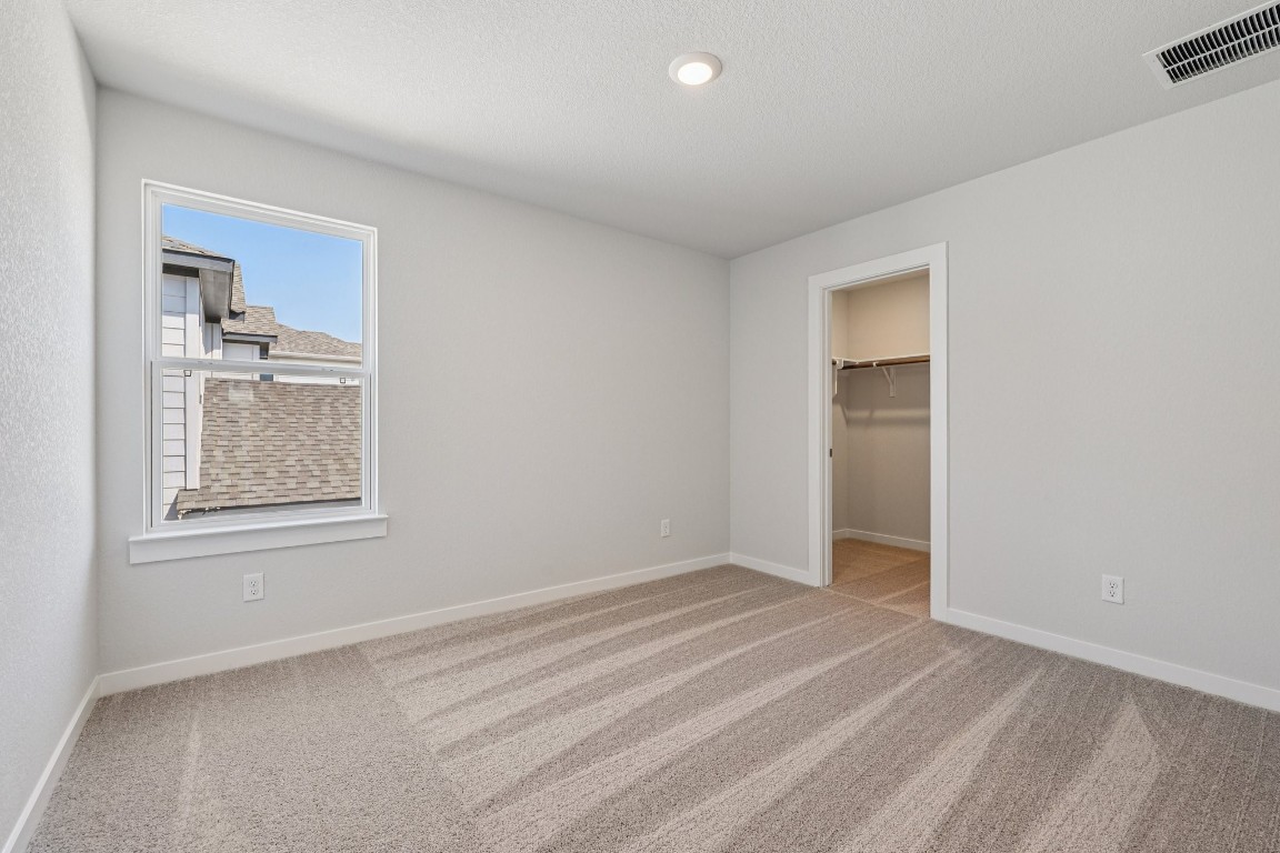 1216 Lavender Way Georgetown, TX 78628 - Photo 22 of 40 a view of an empty room with a window