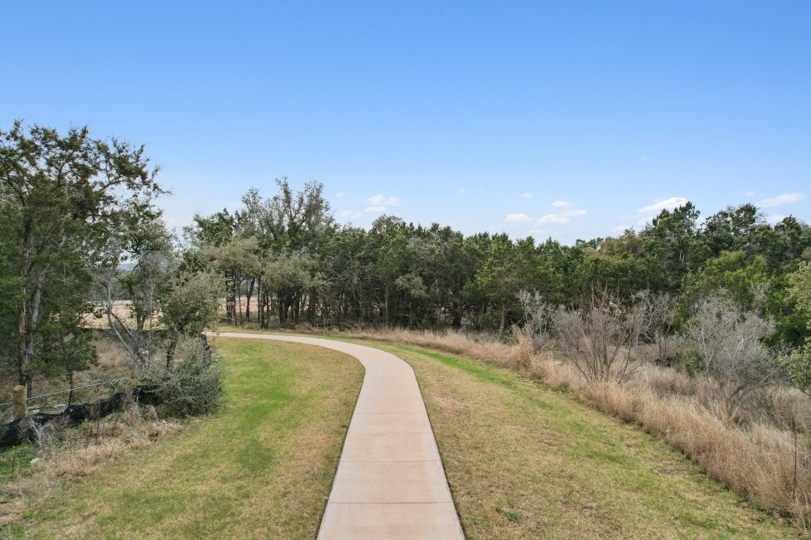 1216 Lavender Way Georgetown, TX 78628 - Photo 35 of 40 a view of a pathway with a wrought fence
