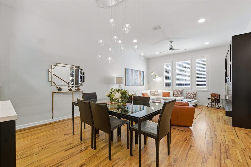 6269 Oram Street, Unit 23 Dallas, TX 75214 - Photo 11 of 39 a view of a dining room with furniture and wooden floor