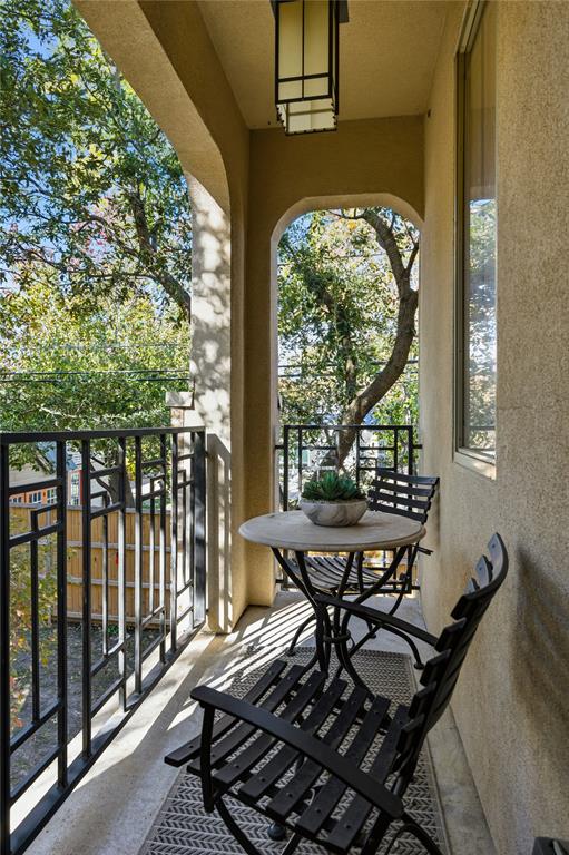 6269 Oram Street, Unit 23 Dallas, TX 75214 - Photo 24 of 39 a view of a patio with table and chairs and wooden floor