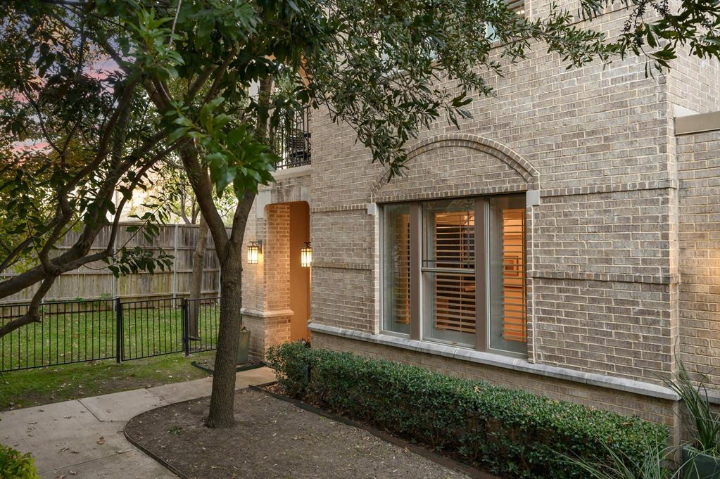 6269 Oram Street, Unit 23 Dallas, TX 75214 - Photo 3 of 39 a front view of a house with a porch
