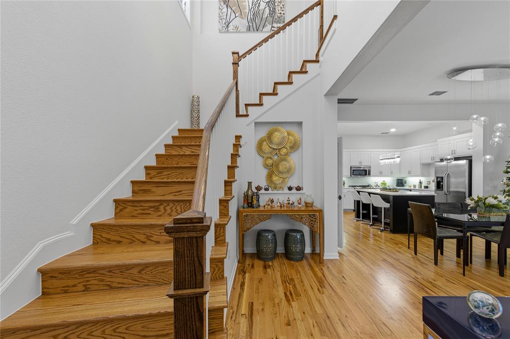 6269 Oram Street, Unit 23 Dallas, TX 75214 - Photo 7 of 39 a view of entryway and hall with wooden floor