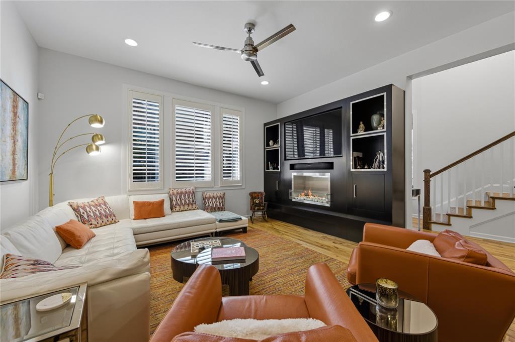 6269 Oram Street, Unit 23 Dallas, TX 75214 - Photo 9 of 39 a living room with furniture ceiling fan and a window