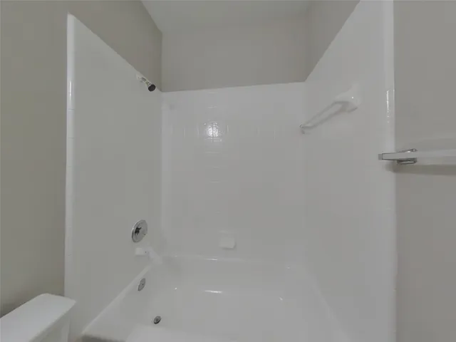 an empty room with wooden floor