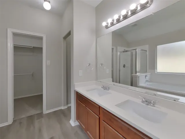 a bathroom with a bathtub and a shower