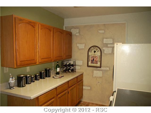 110 West Cheyenne Road Colorado Springs, CO 80906 - Photo 3 of 25 Part of the kitchen in the main house.
