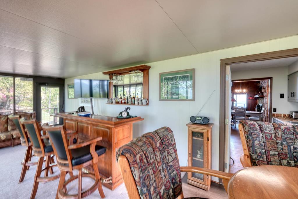 980 Mining Gap Road Young Harris, GA 30582 - Photo 23 of 70 a view of a dining room with furniture and chandelier