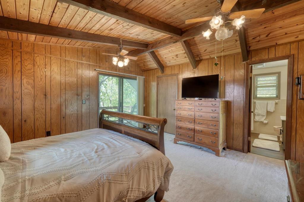 980 Mining Gap Road Young Harris, GA 30582 - Photo 28 of 70 a bedroom with a bed and a flat tv screen