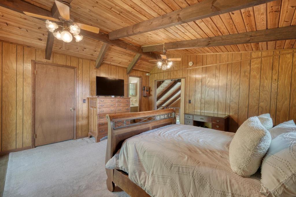 980 Mining Gap Road Young Harris, GA 30582 - Photo 29 of 70 a bedroom with a bed and a flat screen tv