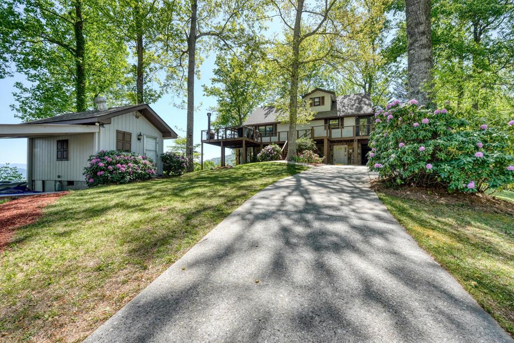 980 Mining Gap Road Young Harris, GA 30582 - Photo 34 of 70 a front view of a house with garden