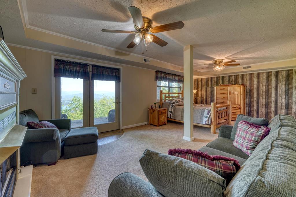 980 Mining Gap Road Young Harris, GA 30582 - Photo 36 of 70 a living room with furniture and a large window