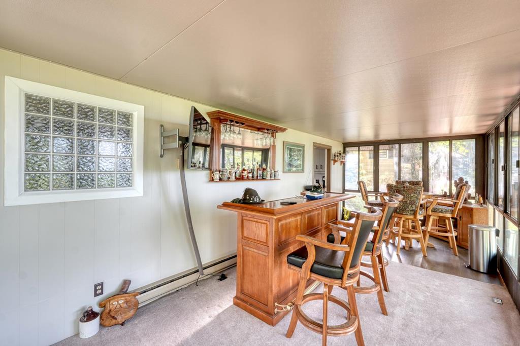 980 Mining Gap Road Young Harris, GA 30582 - Photo 37 of 70 a dining room with furniture and wooden floor