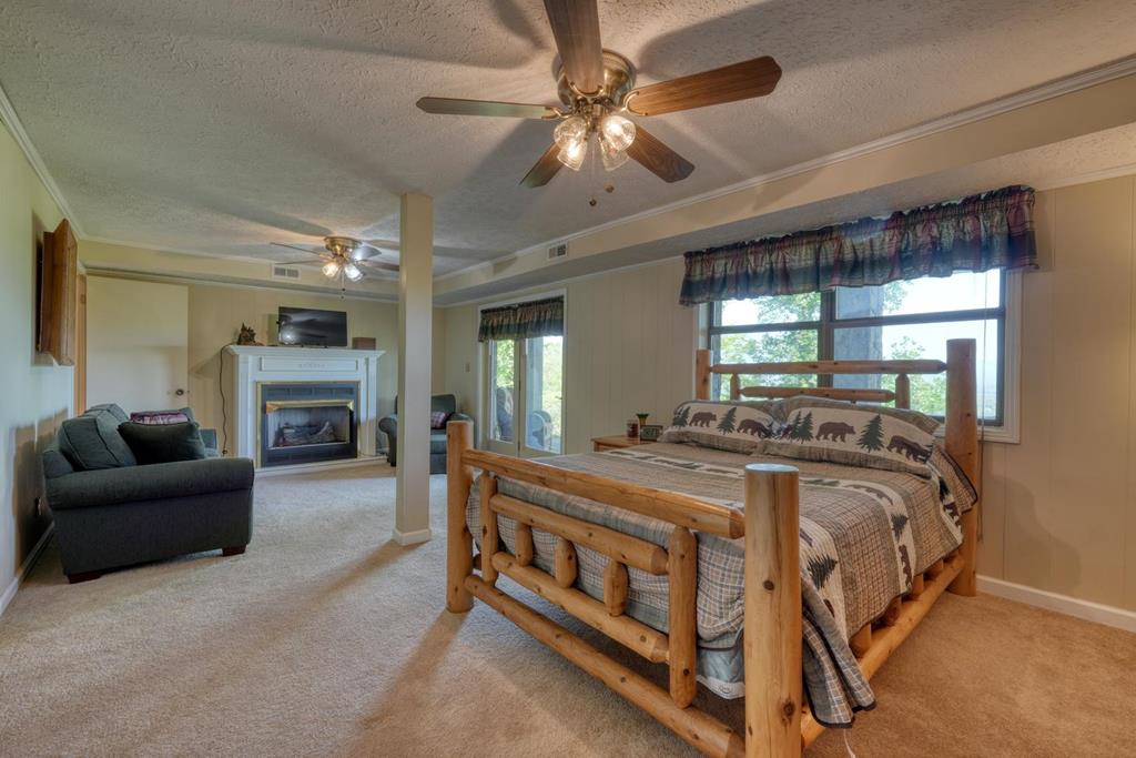 980 Mining Gap Road Young Harris, GA 30582 - Photo 40 of 70 a bed room with a bed and furniture