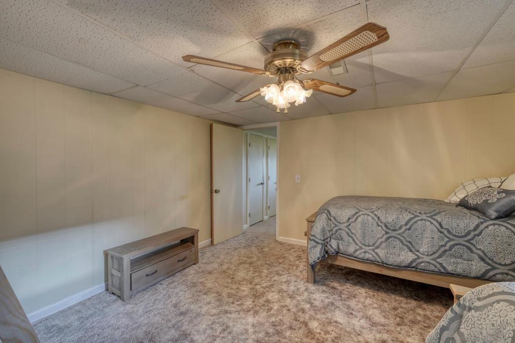 980 Mining Gap Road Young Harris, GA 30582 - Photo 43 of 70 a bedroom with a bed and ceiling fan