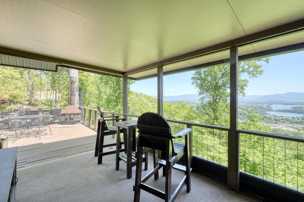 980 Mining Gap Road Young Harris, GA 30582 - Photo 50 of 70 a view of a city from a dining room with large windows