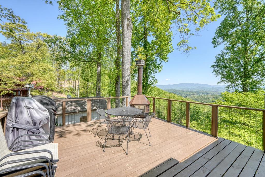 980 Mining Gap Road Young Harris, GA 30582 - Photo 54 of 70 a view of a balcony with two chairs and a table