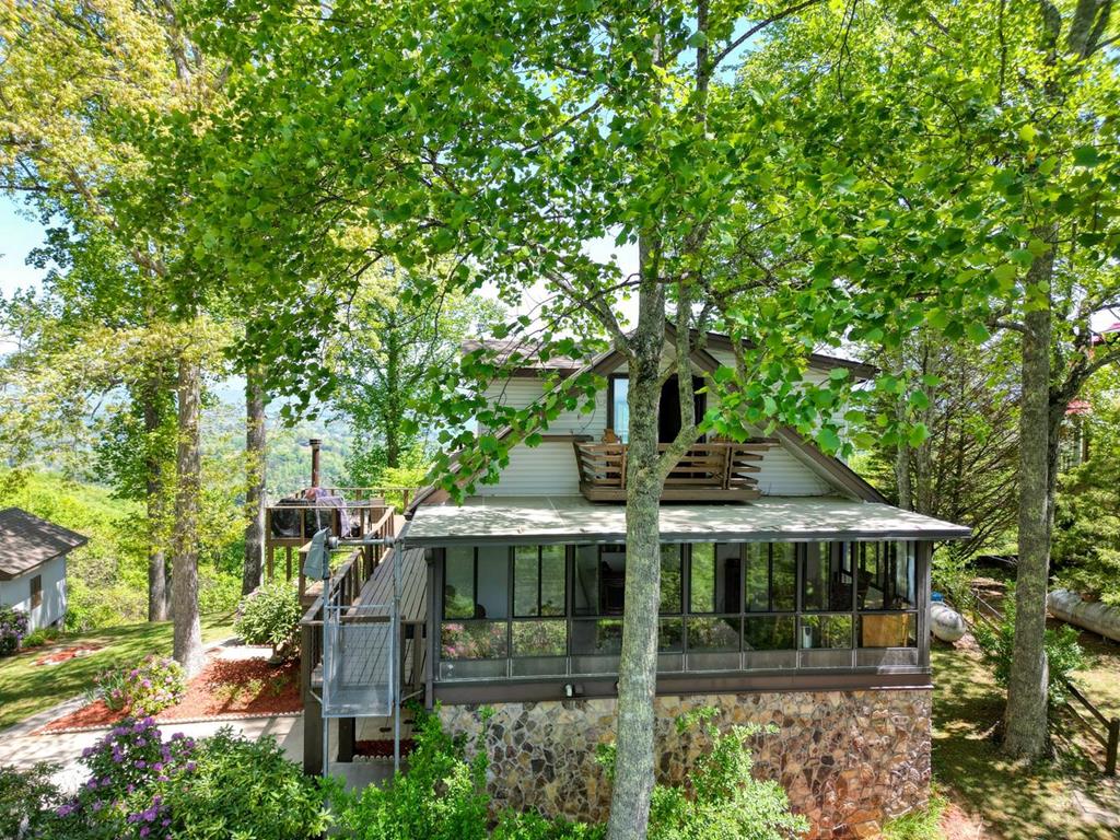 980 Mining Gap Road Young Harris, GA 30582 - Photo 7 of 70 a front view of a house with garden