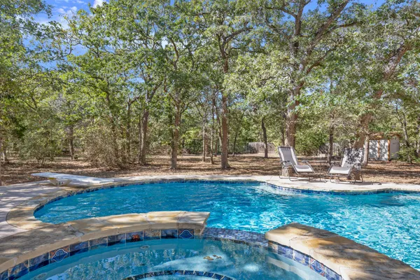 a view of backyard with trees