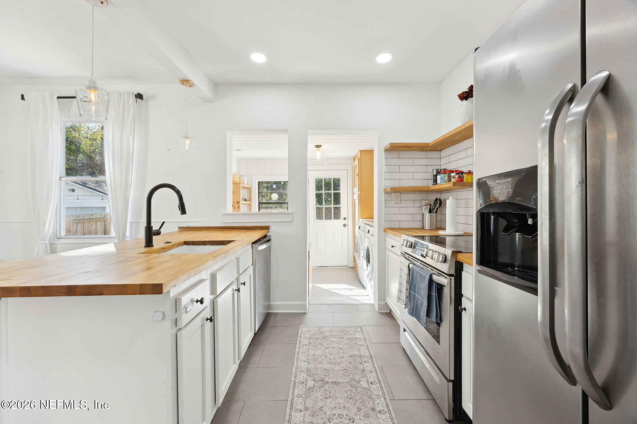 1171 Scotten Road Jacksonville, FL 32205 - Photo 12 of 30 a kitchen with stainless steel appliances granite countertop a refrigerator a sink and a stove