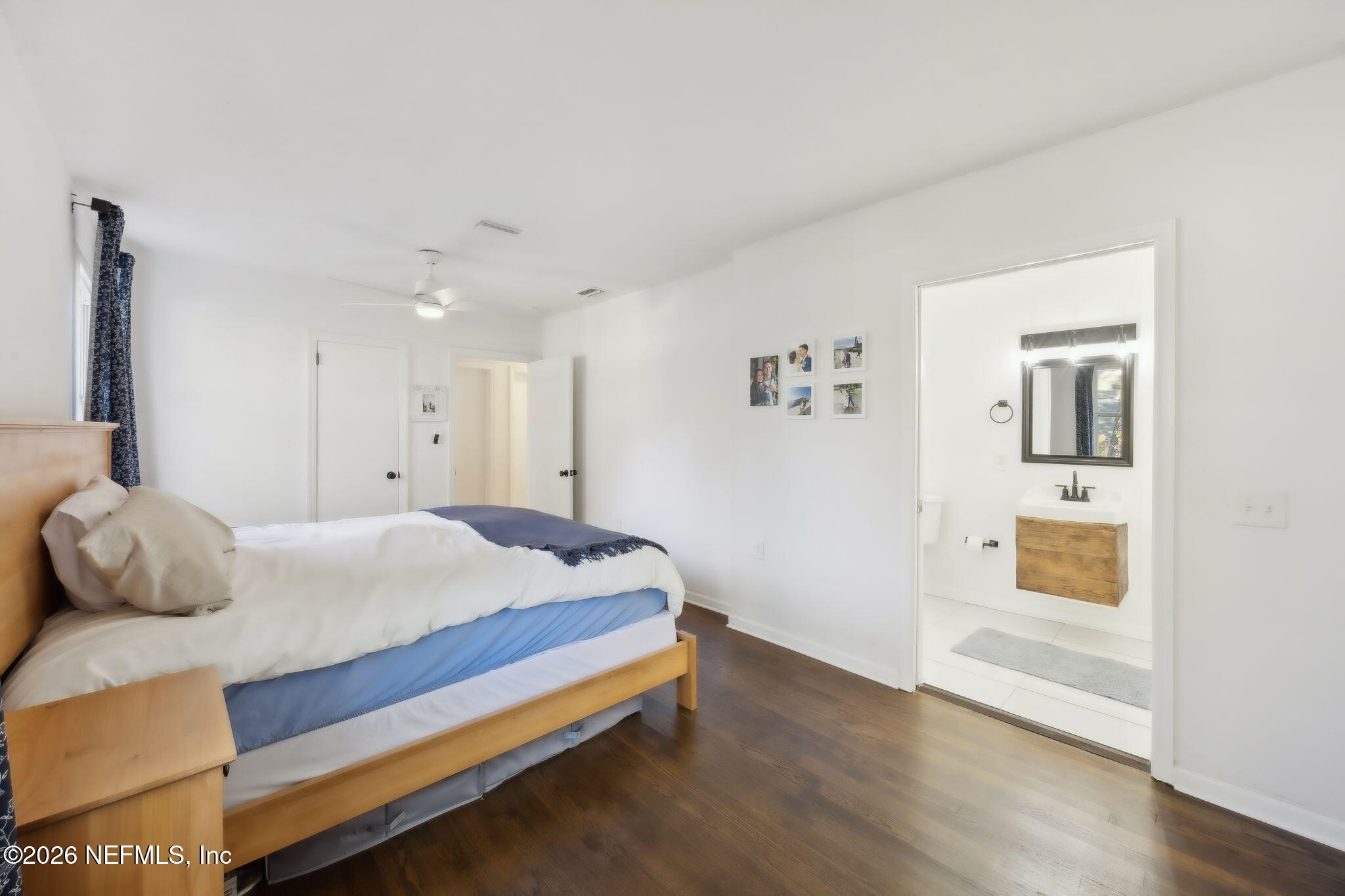 1171 Scotten Road Jacksonville, FL 32205 - Photo 18 of 30 a bedroom with a bed and lamp