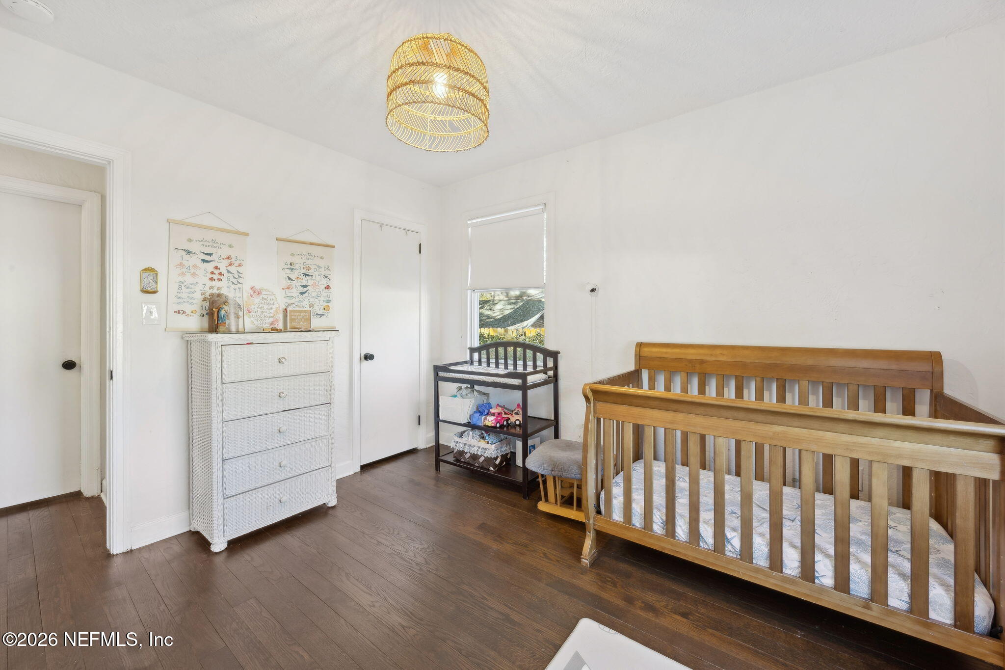 1171 Scotten Road Jacksonville, FL 32205 - Photo 24 of 30 a bedroom with a bed and a chandelier