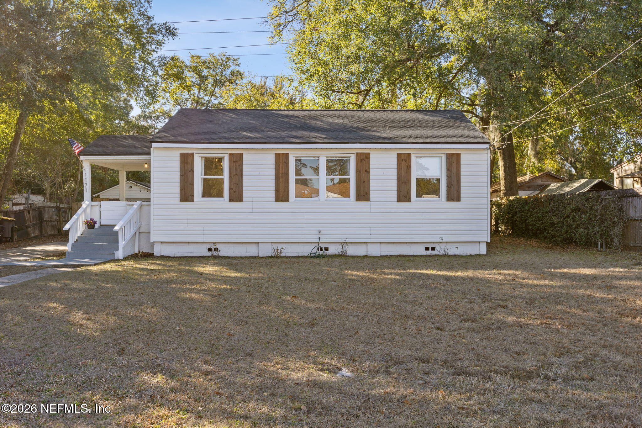 1171 Scotten Road Jacksonville, FL 32205 - Photo 25 of 30 a front view of a house with a yard and garage