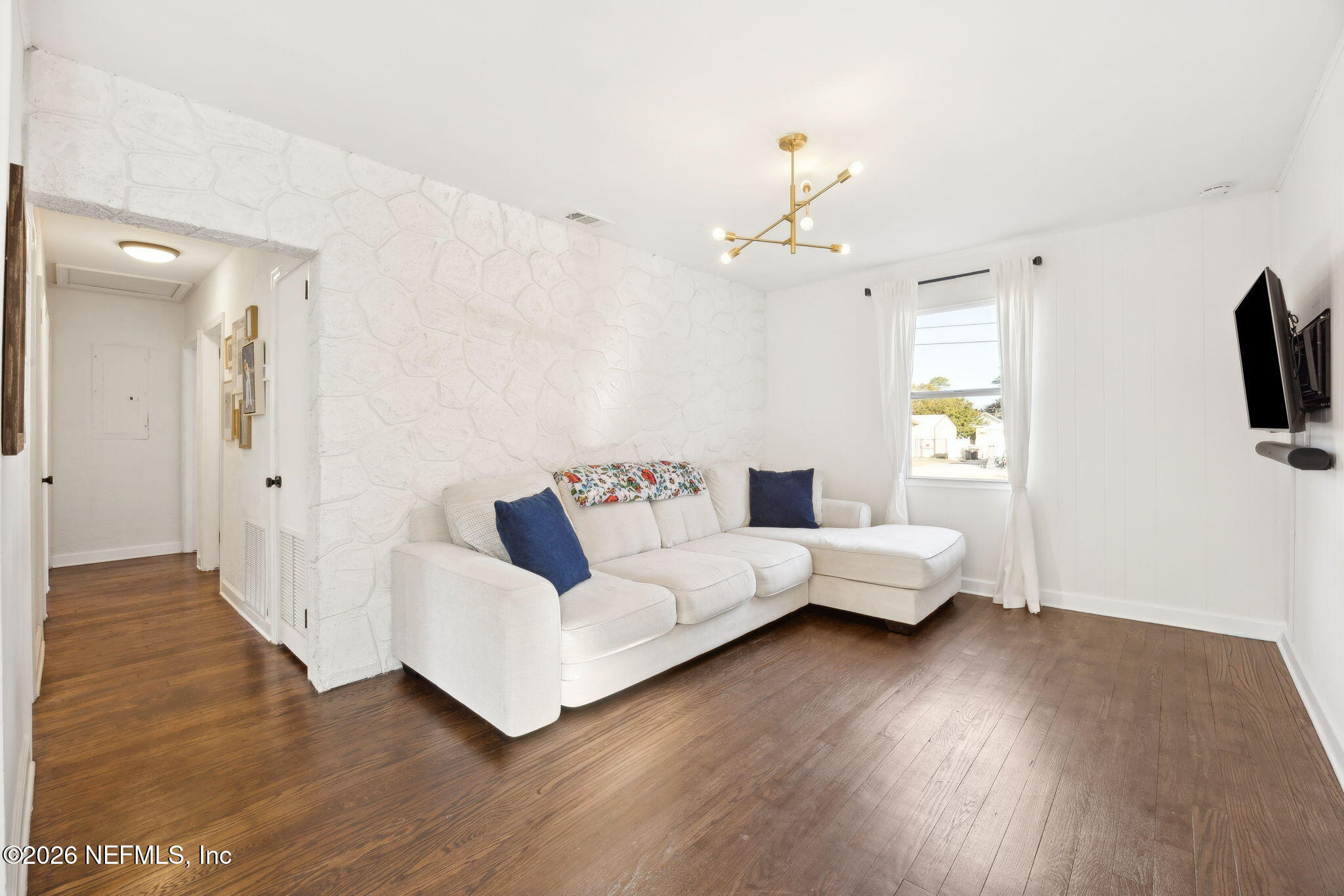 1171 Scotten Road Jacksonville, FL 32205 - Photo 6 of 30 a living room with furniture and a flat screen tv