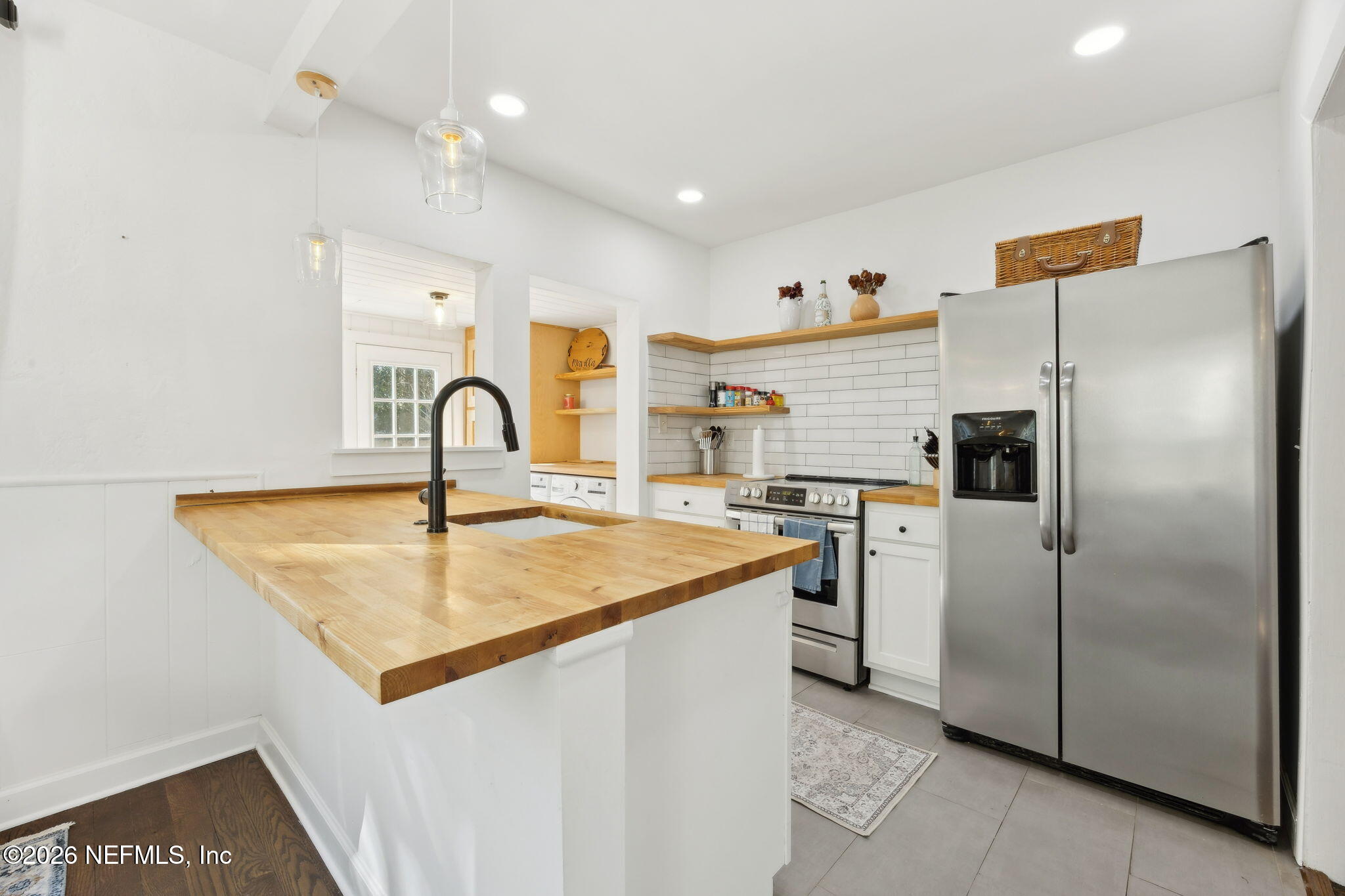 1171 Scotten Road Jacksonville, FL 32205 - Photo 10 of 30 a kitchen with stainless steel appliances granite countertop a refrigerator a sink and a stove