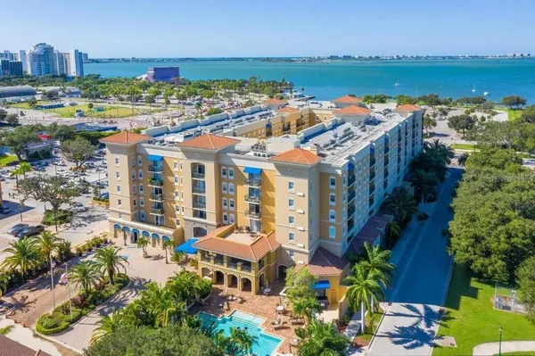 a view of building with outdoor space and lake view